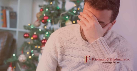 man with hand over his face