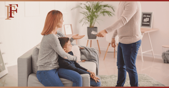 dad handing mom child support